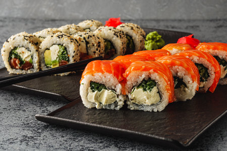 Fresh Sushi Rolls with Salmon and Tuna, Japanese Cuisine on a Gourmet Seafood Plate.の写真素材