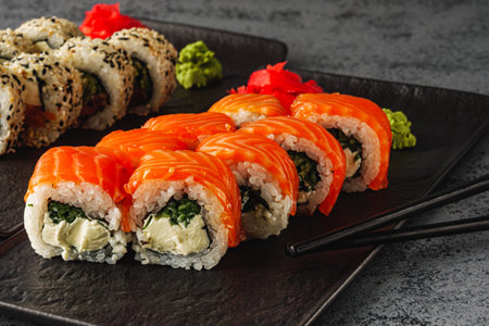 Fresh Sushi Rolls with Salmon and Tuna, Japanese Cuisine on a Gourmet Seafood Plate.の写真素材