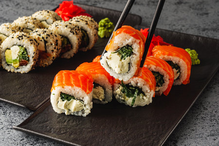 Fresh Sushi Rolls with Salmon and Tuna, Japanese Cuisine on a Gourmet Seafood Plate.の写真素材