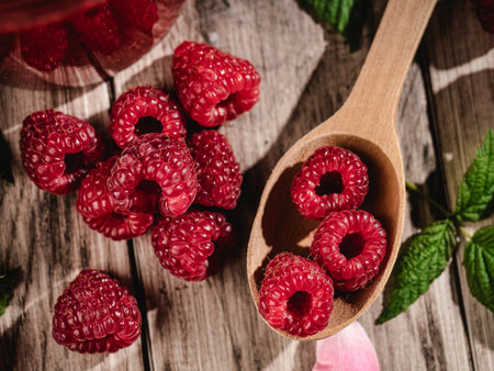 Fresh Raspberries: Juicy, Ripe Berries for a Healthy Summer Snack on a Wooden Background.の写真素材