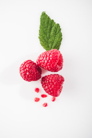 Fresh Raspberries: Juicy, Ripe Berries for a Healthy Summer Snack on a white background.の写真素材