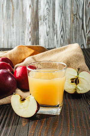 Organic Apple Cider and Fresh Red Apples, Healthy Autumn Beverage with Juicy Sweet Fruit.の写真素材