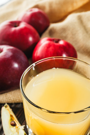 Organic Apple Cider and Fresh Red Apples, Healthy Autumn Beverage with Juicy Sweet Fruit.の写真素材