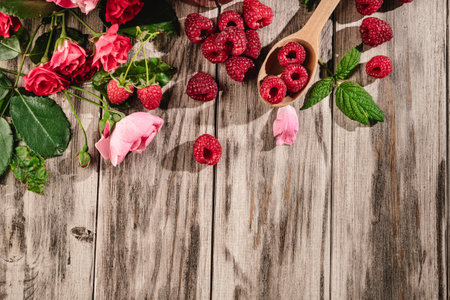 Fresh Raspberries: Juicy, Ripe Berries for a Healthy Summer Snack on a Wooden Background.