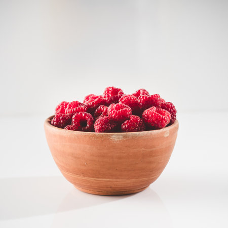 Fresh Raspberries: Juicy, Ripe Berries for a Healthy Summer Snack on a white background.の写真素材
