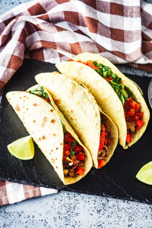 Delicious Spicy Mexican Tacos with Beef, Salsa, and Vegetables, Homemade Street Food, Healthy and Juicy Meal.の写真素材