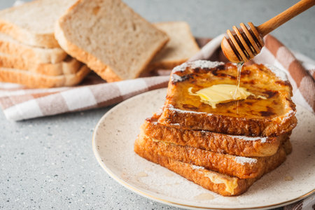 French Toast with Honey and Butter, Sweet Breakfast Delight, Delicious and Tasty Morning Treat.の写真素材