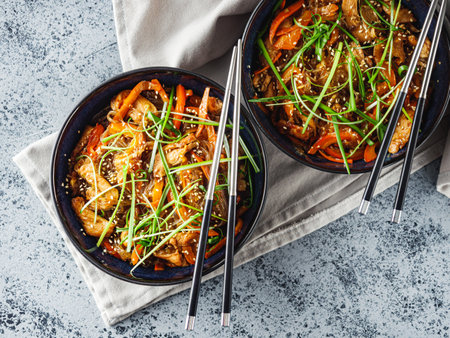 Wok Chicken with Funchoza and Vegetables, Asian Stir-Fry Delight, Tasty and Healthy Gourmet Dish.の写真素材