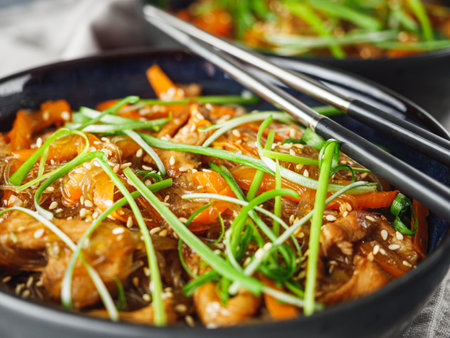 Wok Chicken with Funchoza and Vegetables, Asian Stir-Fry Delight, Tasty and Healthy Gourmet Dish.の写真素材