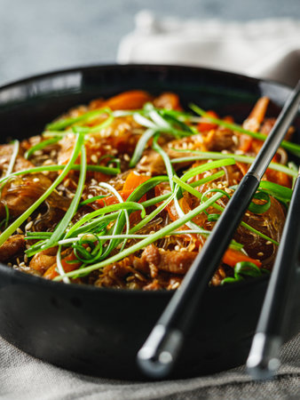 Wok Chicken with Funchoza and Vegetables, Asian Stir-Fry Delight, Tasty and Healthy Gourmet Dish.の写真素材