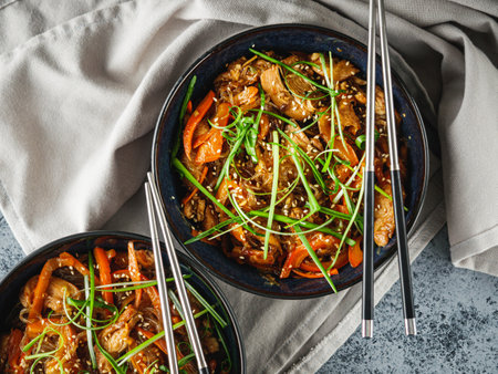 Wok Chicken with Funchoza and Vegetables, Asian Stir-Fry Delight, Tasty and Healthy Gourmet Dish.の写真素材