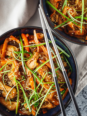 Wok Chicken with Funchoza and Vegetables, Asian Stir-Fry Delight, Tasty and Healthy Gourmet Dish.の写真素材