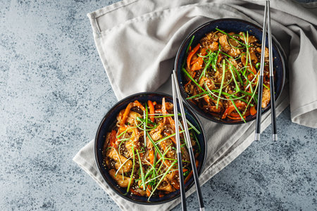 Wok Chicken with Funchoza and Vegetables, Asian Stir-Fry Delight, Tasty and Healthy Gourmet Dish.の写真素材