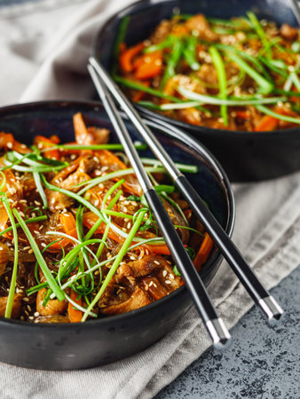 Wok Chicken with Funchoza and Vegetables, Asian Stir-Fry Delight, Tasty and Healthy Gourmet Dish.の写真素材