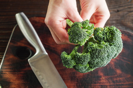 Young Woman Preparing Fresh Broccoli, Rustic Cooking.