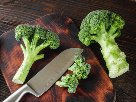 Young Woman Preparing Fresh Broccoli, Rustic Cooking.の写真素材