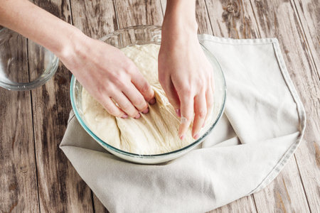 Young woman Making Homemade Focaccia Bread Traditional Italian Recipe.の写真素材