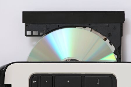 close-up on a cd dvd burner drive inside a laptopの写真素材