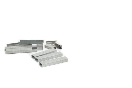 Stack of metal staples  Isolated on a white background の写真素材