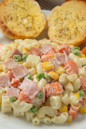 Macaroni salad with mayonnaise and vegetables.の写真素材
