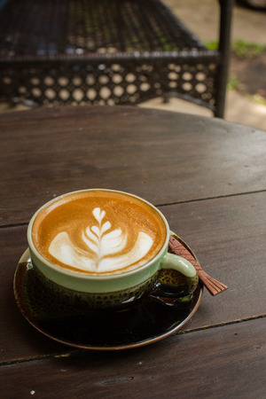 Latte Art coffee with coffee beanの写真素材