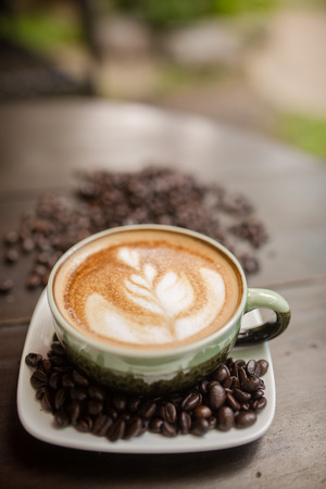 Latte Art coffee with coffee beanの写真素材