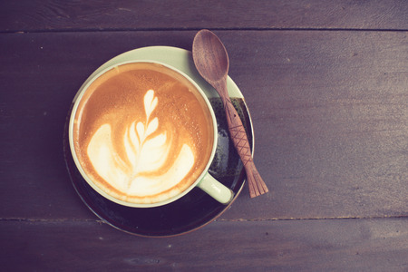 Latte Art coffee with coffee bean vintage colorの写真素材