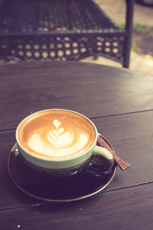 Latte Art coffee with coffee bean vintage colorの写真素材