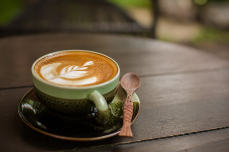 Latte Art coffee with coffee beanの写真素材