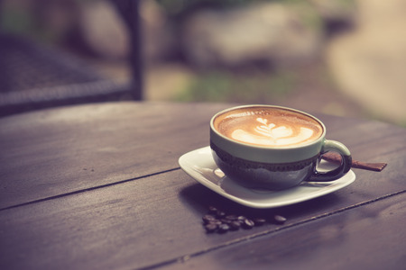 Latte Art coffee with coffee bean vintage colorの写真素材
