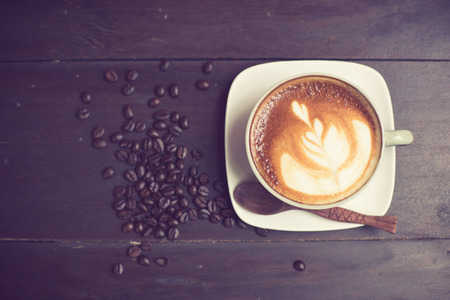 Latte Art coffee with coffee bean vintage colorの写真素材