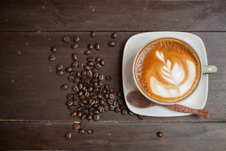 Latte Art coffee with coffee beanの写真素材