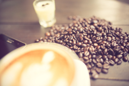 Latte Art coffee with coffee bean vintage colorの写真素材