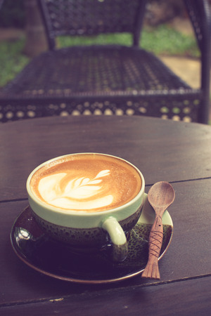 Latte Art coffee with coffee bean vintage colorの写真素材