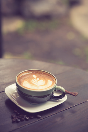 Latte Art coffee with coffee bean vintage colorの写真素材