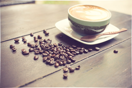 Latte Art coffee with coffee bean vintage colorの写真素材