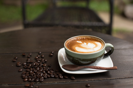 Latte Art coffee with coffee beanの写真素材
