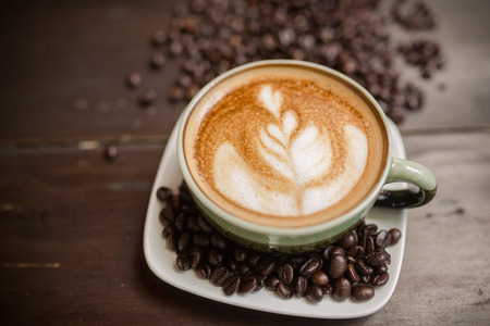 Latte Art coffee with coffee beanの写真素材