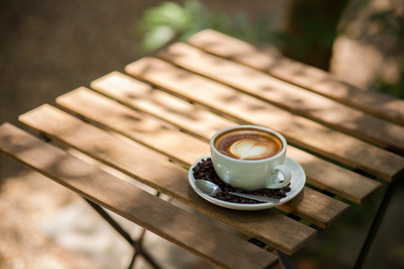 Latte Art coffee with coffee beanの写真素材