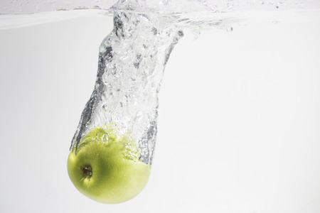 green apple splash waterの写真素材