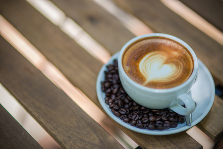 Latte Art coffee with coffee beanの写真素材