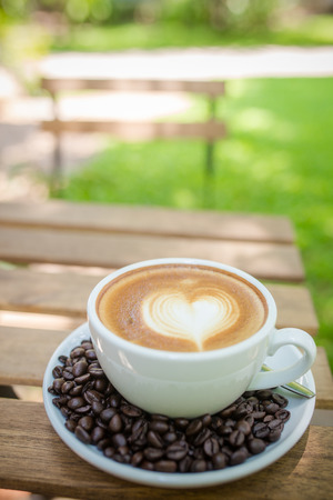 Latte Art coffee with coffee beanの写真素材