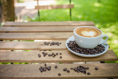 Latte Art coffee with coffee beanの写真素材