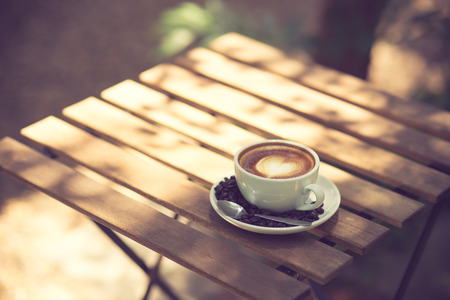 Latte Art coffee with coffee bean vintage colorの写真素材
