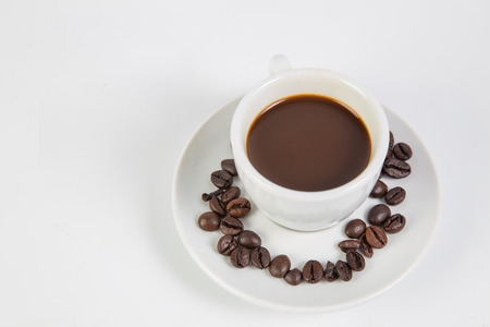 Coffee cup and beans on a white background.の写真素材
