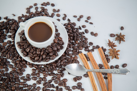 Coffee cup and beans on a white background.の写真素材