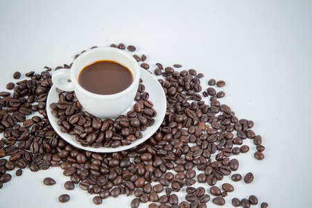 Coffee cup and beans on a white background.の写真素材