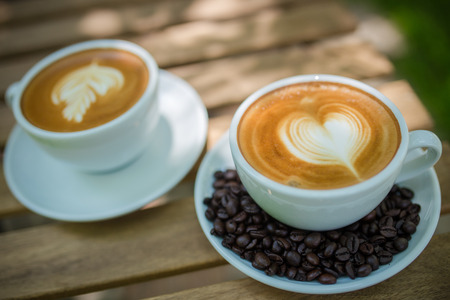 Latte Art coffee with coffee beanの写真素材