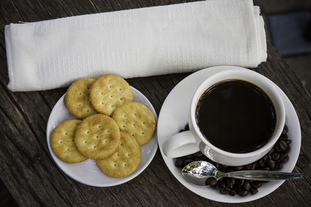 black coffee and coffee bean with biscuitsの写真素材