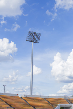 Big spotlights lighting tower at an sport arena stadium sky backgroundの写真素材
